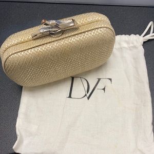 DVF clutch with chain strap and dust bag.